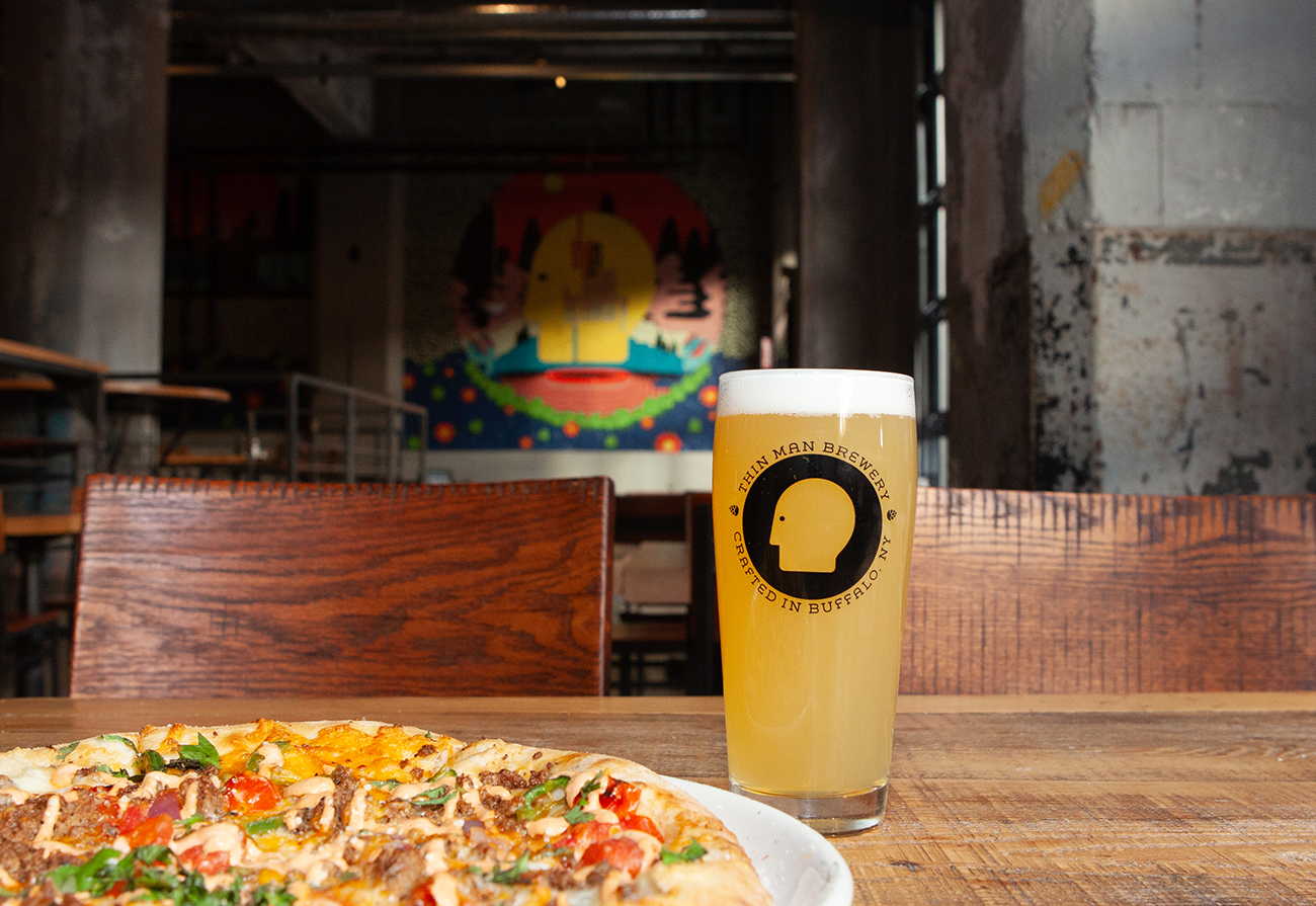 thin man beer with taco pizza